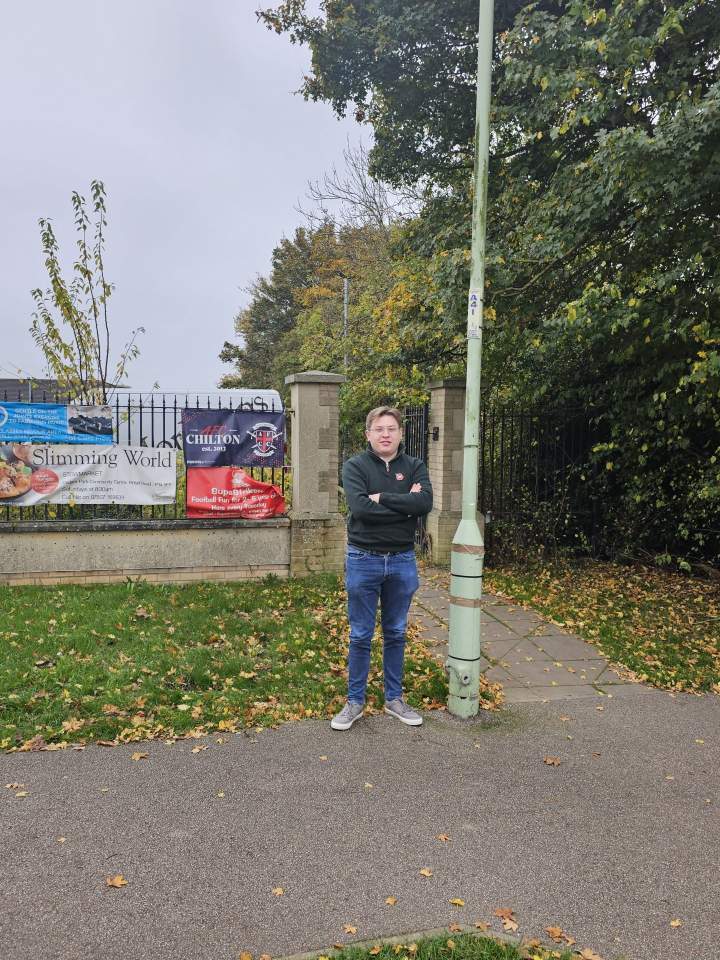 Person standing by bus stop